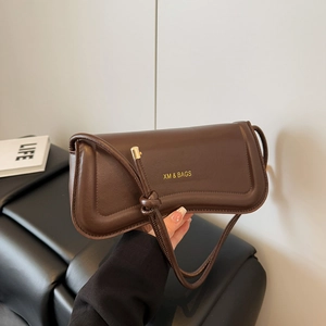 Deep chocolate brown PU leather shoulder bag with a sleek curved silhouette and gold logo