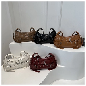 Close-up of five glossy PU leather shoulder bags in various colors with metallic buckle details