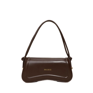 Solid deep brown vintage underarm bag with matte leather finish and arched base design