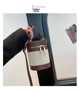 Detail of the brown cylinder bucket bag with PU leather and canvas patchwork