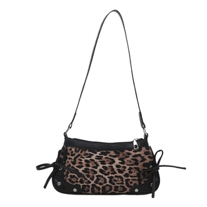 Chic leopard print crescent underarm bag with black leather trim and bow details