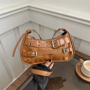 Retro brown Y2K shoulder bag with silver buckle straps and glossy faux leather finish