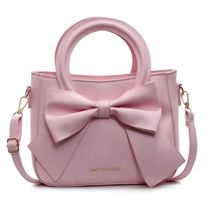 Sac seau rose pour femme avec grand nœud élégant et bandoulière réglable pratique