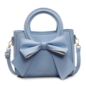 Elegant light blue PU leather handbag with large decorative bow and top handle