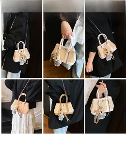 Detailed views of mini woven straw bag with plush bear charm and chain shoulder strap