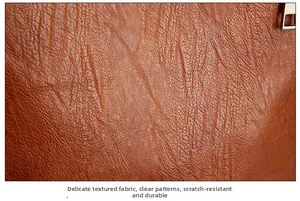 Close-up of brown litchi grain leather texture showing scratch-resistant surface