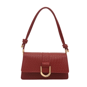 Elegant red woven texture shoulder bag with golden horseshoe buckle and chic knot straps