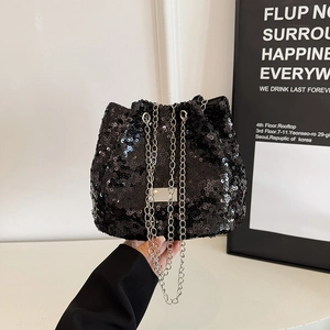 Fashionable black sequin bucket bag with silver chain strap for evening parties
