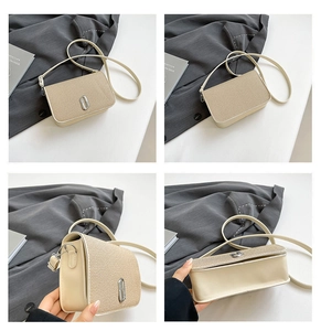Macro detail of beige square bag featuring shimmer fabric texture and silver hardware