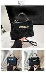 Detail of the black leather patchwork bag showing glittering sequins and gold twist lock