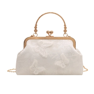 Elegant white lace shell bag with 3D butterfly appliqués and carved gold metal handle