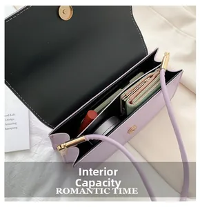 Detail view of the lavender crossbody bag interior showing organized compartments