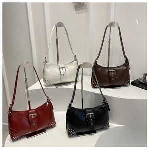 Chic underarm bags in red, white, brown and black with vintage silver rivet details