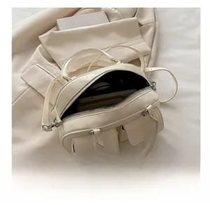 Detailed internal view showing the large capacity of the beige baguette bag