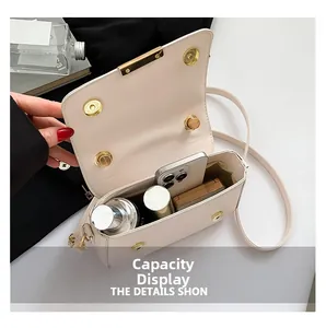 Internal capacity view of the cream textured crossbody bag with daily essentials