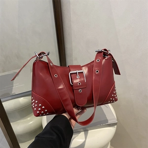 Retro burgundy leather shoulder bag with silver rivet details and adjustable strap