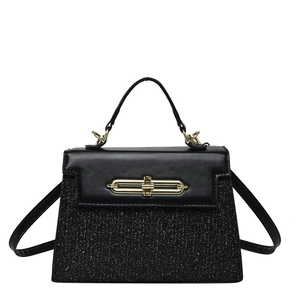 Retro black leather and silver sequin handbag with gold trapezoid lock in front view