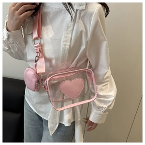 Stylish pink transparent crossbody bag with heart detail and matching round coin pouch