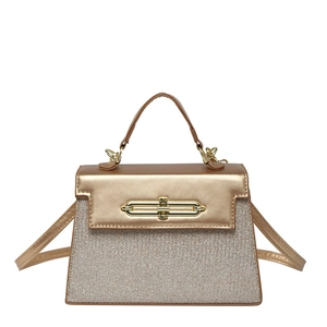 Elegant gold metallic structured handbag with top handle and crossbody strap for women