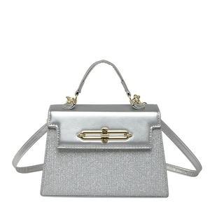 Silver sequin trapezoid handbag with gold metal clasp and detachable shoulder strap