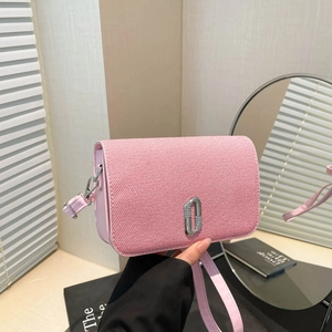 Pink woven crossbody bag featuring a silver crystal-embellished J buckle on the front