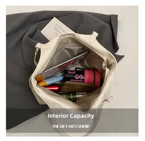 Interior view of large white tote bag showing storage capacity for tablet and cosmetics