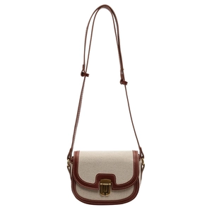 Retro canvas saddle bag with brown leather trim and metal clasp for women