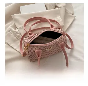 Pink printed Boston bag showing large interior capacity for phone and essentials