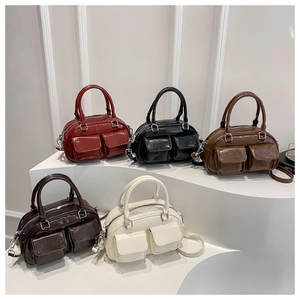 Group of retro glossy leather Boston bags in burgundy, black, brown, and cream white