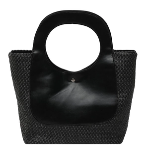 Retro contrast patchwork straw handbag with round cutout handle on white background