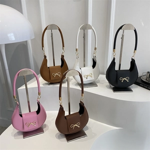 Minimalist crescent hobo bags in multiple colors for 2025 spring fashion collection.
