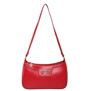 Chic red faux leather underarm bag with metal bow detail and floral zipper charm