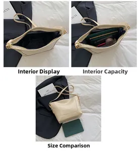 Macro view of beige leather bucket bag interior showing large capacity and zipper closure