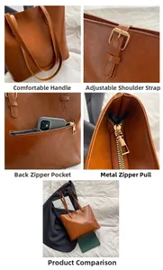 Detail view of large brown leather tote bag with adjustable strap and metal zipper