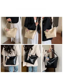 Detail shots of the large capacity tote bag in black and cream with a glossy finish