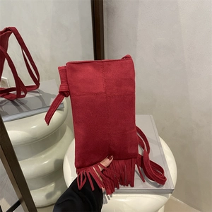 Red suede crossbody bag with bohemian long tassels and adjustable strap for women
