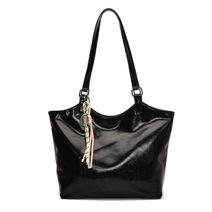 Glossy black high-capacity tote bag with HUANIKOU logo and woven tassel charm