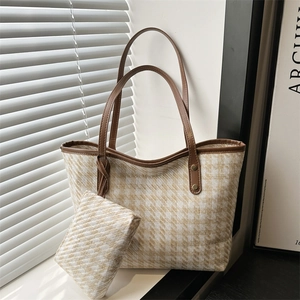 French style woven plaid tote bag with brown leather handles and matching small pouch