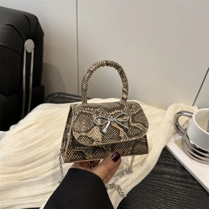 Brown snakeskin mini handbag with silver butterfly buckle and metal chain strap