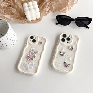 Chic iPhone case with 3D butterfly and pearl accents on a wavy frame cream background