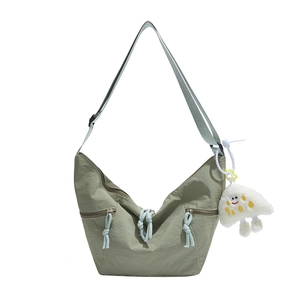 Green crescent crossbody bag with nylon texture and a cute white cloud pendant