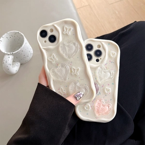 White wavy phone case for iPhone 16 Pro Max with 3D hearts, bows and glitter finish
