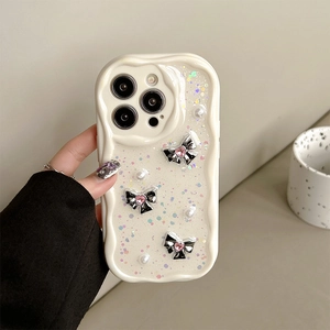 Detail of cream wave iPhone case with sparkling glitter, pearls and 3D butterfly bows