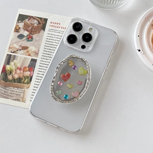 Support de téléphone ovale scintillant avec cœurs 3D colorés et strass sur coque iPhone