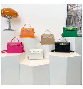 Detailed display of fashionable structured handbags in six vibrant colors with gold locks