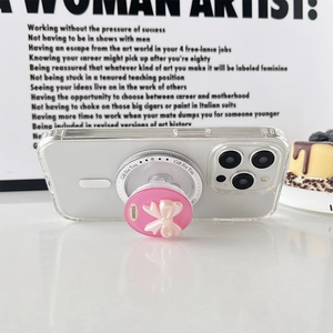Pink bow grip stand on transparent phone case with minimalist aesthetic background