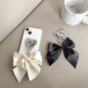 Elegant satin bow phone ring holder with rhinestone heart base in black and cream white