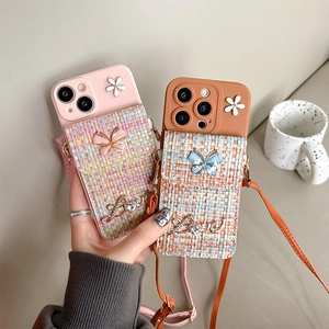 Crossbody iPhone case with tweed pocket, floral decor, butterfly, and shoulder strap