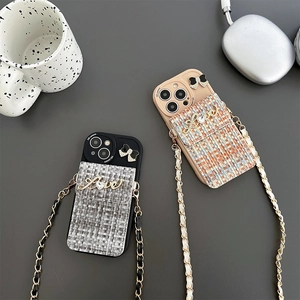 Chic tweed iPhone case with bow, Love metal detail, and crossbody chain strap
