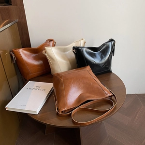 Minimalist vintage oil wax leather bucket bags in brown, beige and black colors